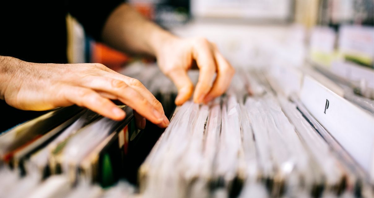 A person looking through records at a store