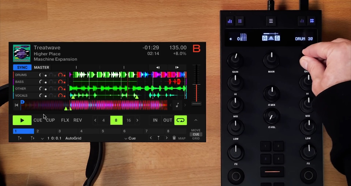 Top down view of Traktor Pro 4 software displaying stem waveforms and the Z1 Mk2 mixer controlling the drum stem. 